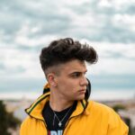 Casual portrait of a fashionable young man in Rome, Italy with a city view.